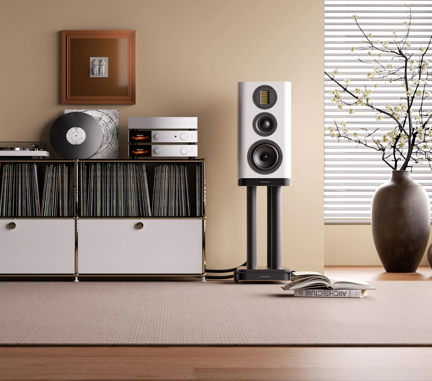 White speaker on a stand in a room with a record player and vinyl records.