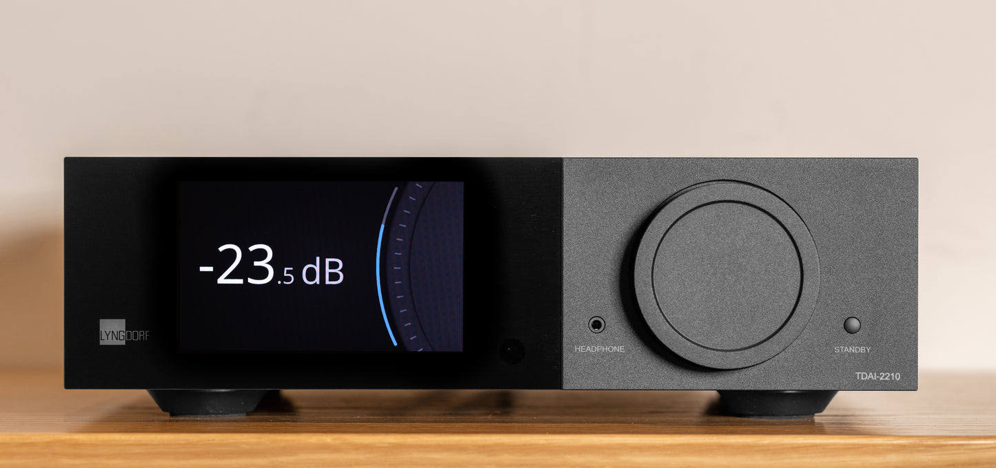 Front view of the Lyngdorf TDAI-2210 digital streaming amplifier featuring a color touchscreen display and signature volume wheel.