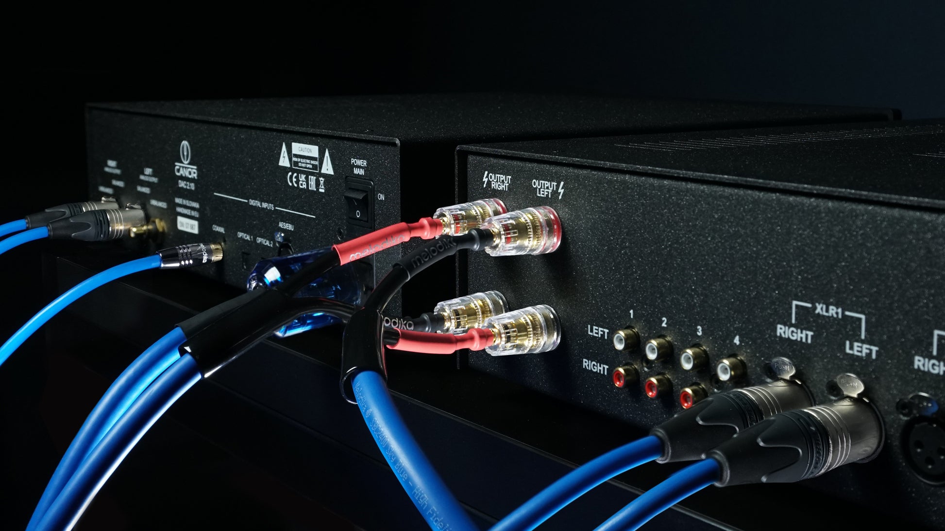 Audio equipment with cables connected with Melodika Sky blue cables on a black background